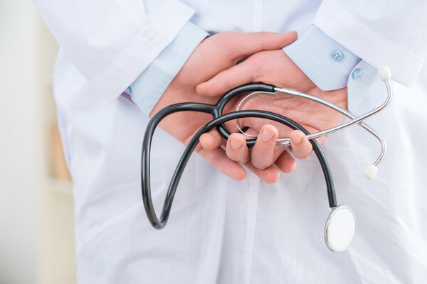 Pleasant pediatrician holding stethoscope