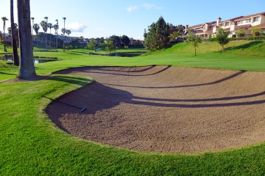 Manicured green grass of Fairway on golf course clipart