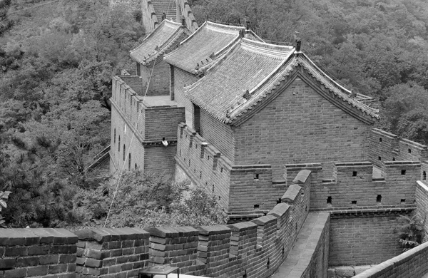 Great Wall of China atop the mountains in the forest, showing air pollution and smog, China