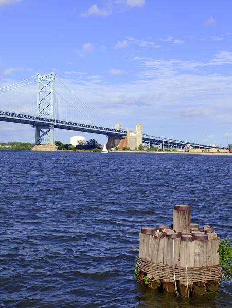 Benjamin Franklin Bridge, offically called the Ben Franklin Bridge, spanning the Delaware River joining Philadelphia, Pennsylvania and Camden, New Jersey carries both rail cars and motor vehicles