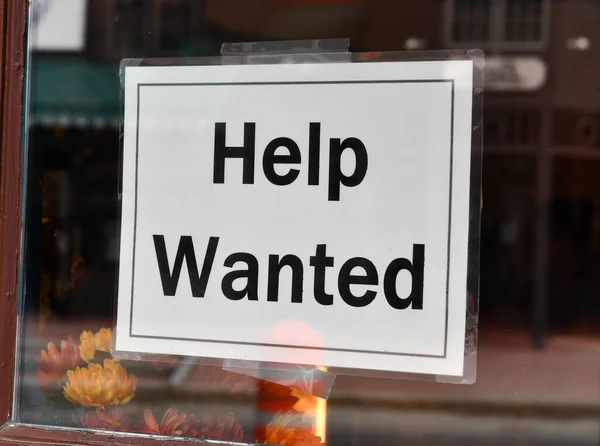 Help wanted sign on store front