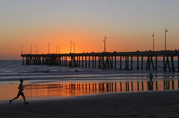 Runner jogging on beach at sunset, Southern California — Stock Photo, Image