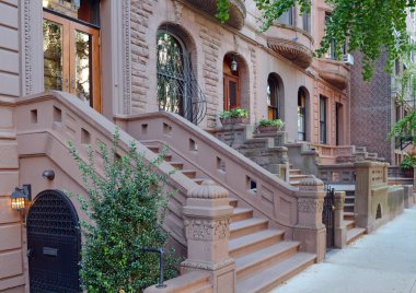 Brownstone apartment building with staircase