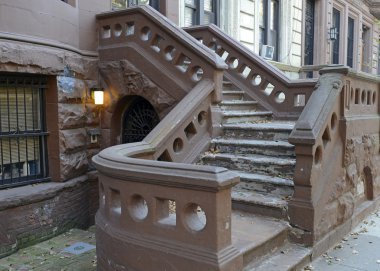 Brownstone apartment building with staircase