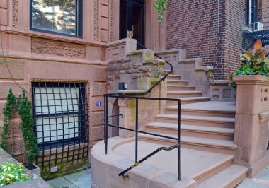Brownstone apartment building with staircase