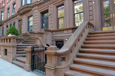 Brownstone apartment building with staircase