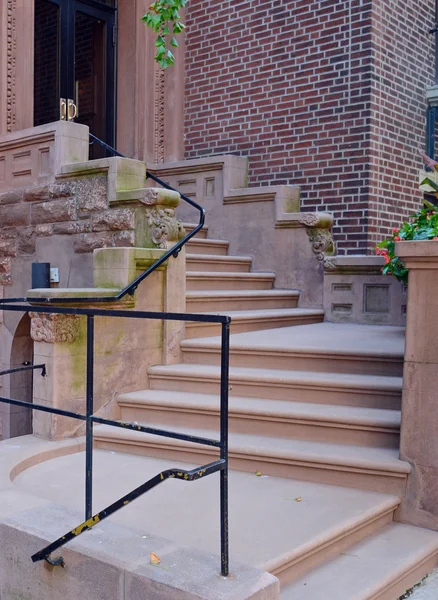 Brownstone apartment building with staircase — 스톡 사진