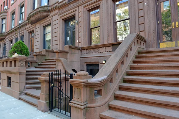Brownstone apartment building with staircase