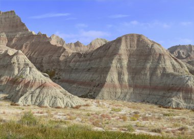 Badlands landscape, formed by deposition and erosion by wind and water, contains some of the richest fossil beds in the world, Badlands National Park, South Dakota, USA clipart