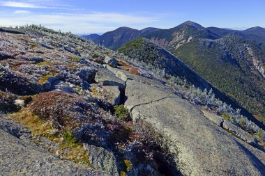 Alpine scene on climb of Gothics Mountain, in Autumn with forest colors in the distance, Adirondacks, New York