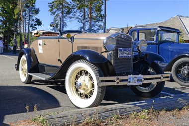 Model A Ford in parking lot clipart