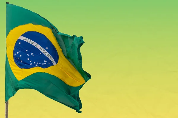 Brazil\'s flag. White background. National symbol. The Brazilian flag is composed of a green rectangle, a yellow diamond, a blue circle and 27 white stars