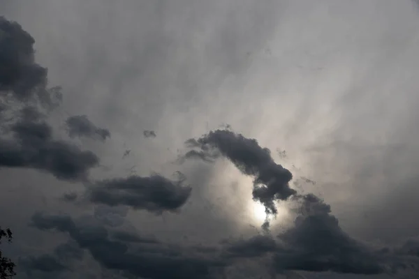 Colorful rain clouds at dusk. Rain-forming clouds. Sunset in the skies of Latin America. Phenomena of nature. Natural watercolors of weather phenomena.