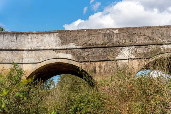 Old stone bridge built at the time of the Brazilian empire in the city of Cachoeira do Sul. Emperor\'s bridge. Ancient structure. Abandoned transport infrastructure. Bridge over the Botucarai River.
