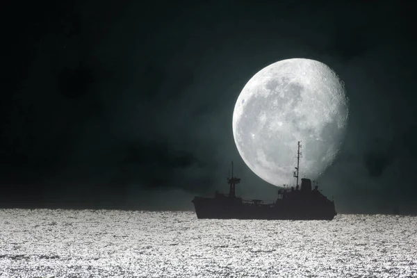 Ship and big Moon. Night sea