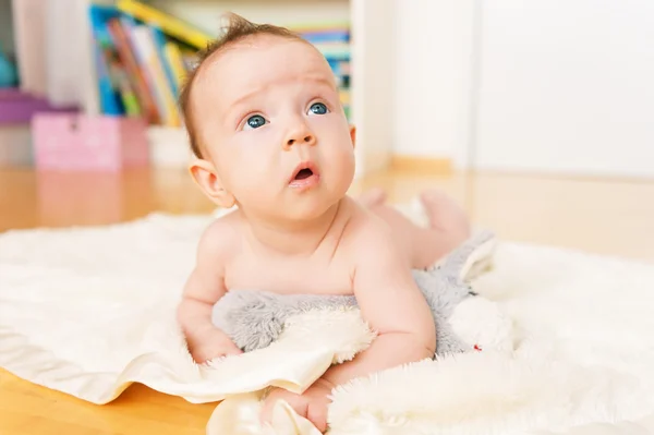 Adorable baby laying on the floor — Stock Photo, Image