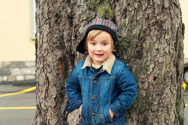 Outdoor portrait of a toddler boy, wearing denim clothes — Stock Photo, Image