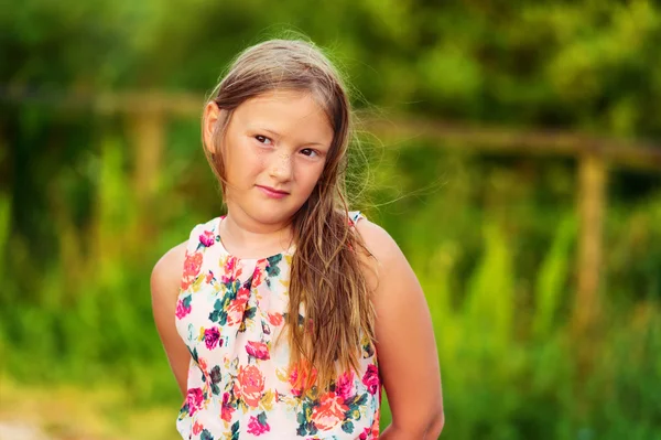 Outdoor portrait of a cute little girl of 8 years — Stock Photo, Image