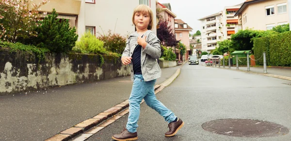 Outdoor portrait of a cute fashion boy in the street — Stock Photo, Image