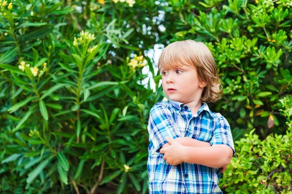 Outdoor portrait of a cute little girl wearing jeans dress — Stock Photo, Image