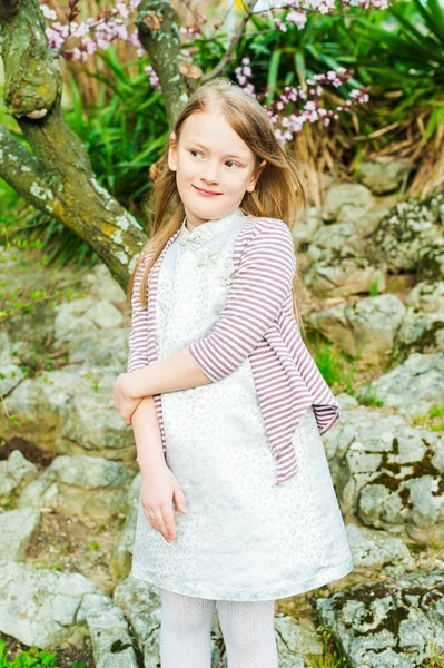 Vertical portrait of a cute little 7-8 year old girl wearing many  accessories Stock Photo by ©annanahabed 140816908