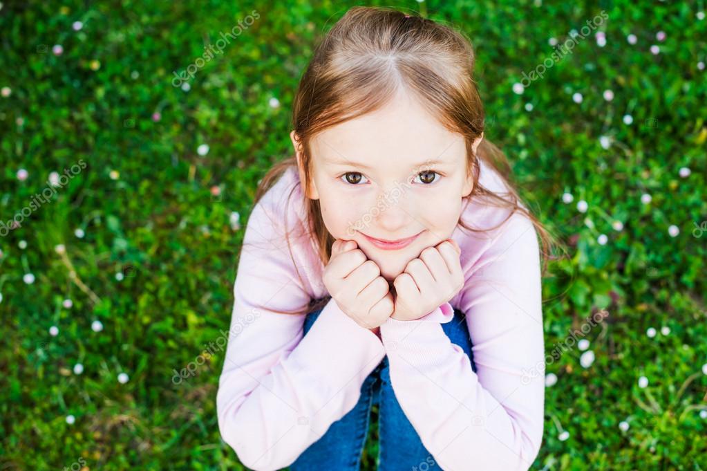 Outdoor portrait of a cute little girl