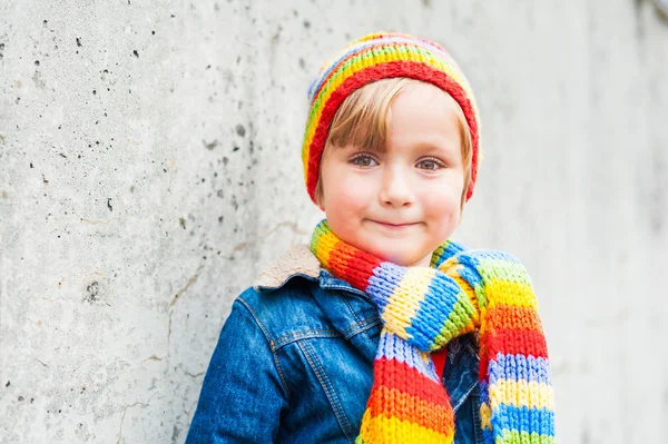 Outdoor portrait of adorable toddler boy wearing colorful hat and scarf — Stock Photo, Image