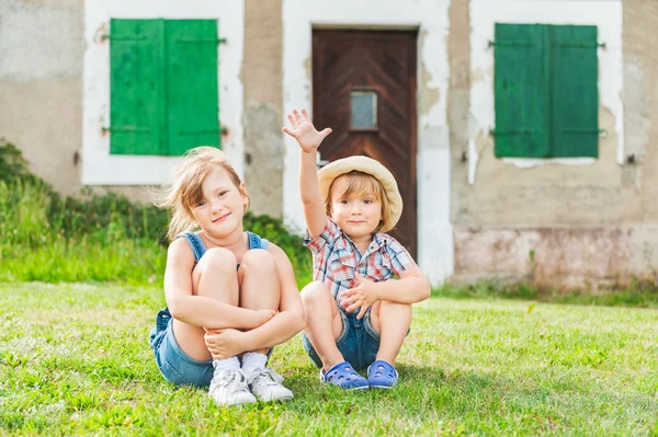 Adorable children resting in a countryside — Stock Photo, Image
