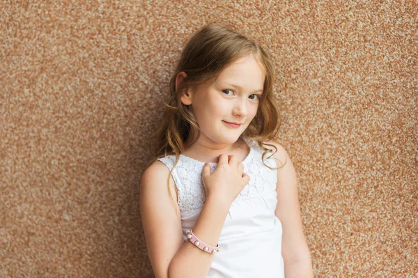 Close up portrait of a cute little girl of 7-8 years old leaning to pink  wall Stock Photo by ©annanahabed 122304756