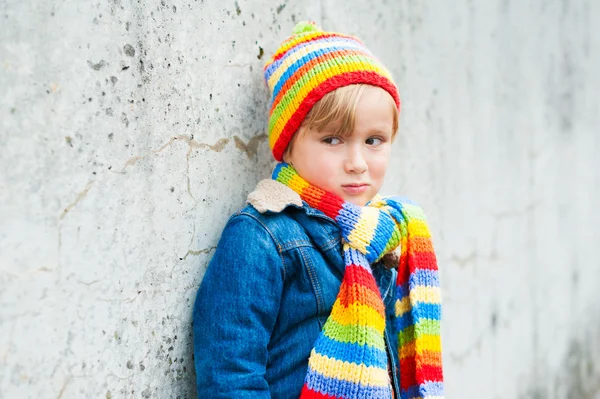 Outdoor portrait of adorable toddler boy wearing colorful hat and scarf — Stock Photo, Image