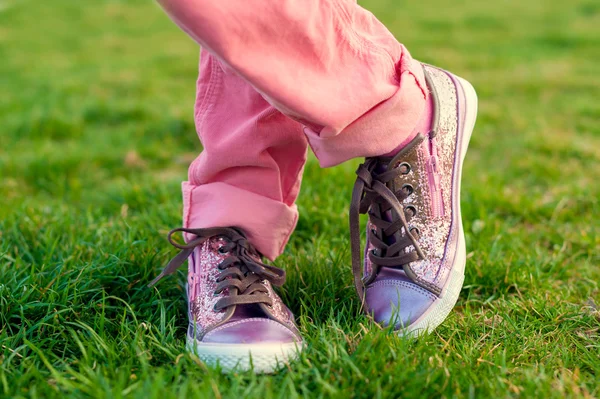 Close up of shiny  tennis shoes on child's feet — Zdjęcie stockowe