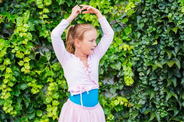 Cute little ballerina girl outdoors, wearing dance clothes — Stock Photo, Image