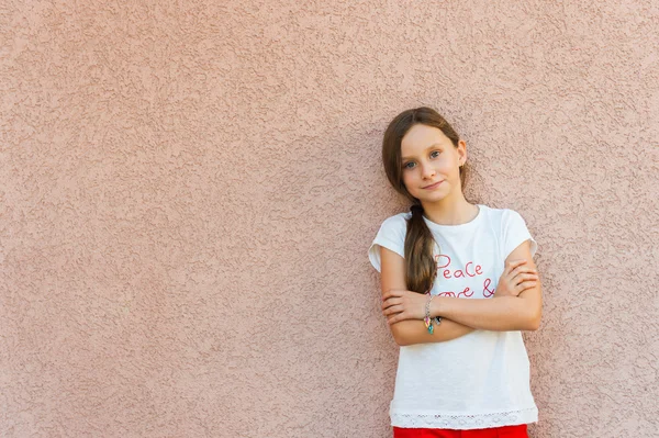 Outdoor portrait of a cute little girl of 9 years old — Stock Photo, Image