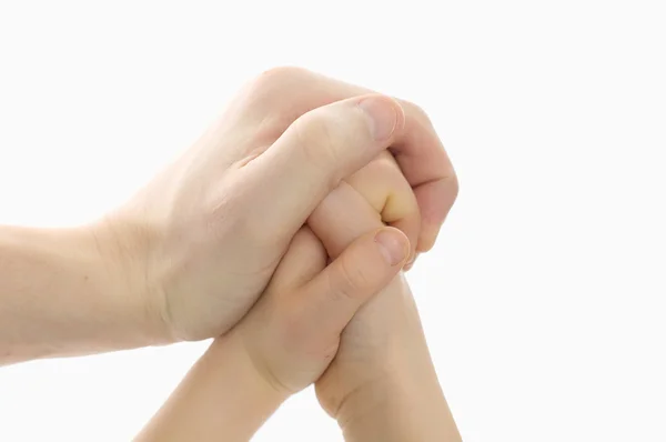 Adult hand holding kid hands — Stock Photo, Image