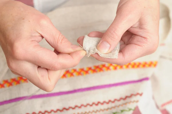 Woman sewing with needle and thread — Stock Photo, Image