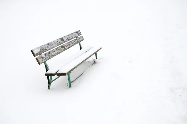 Snowy bench outdoor — Stock Photo, Image