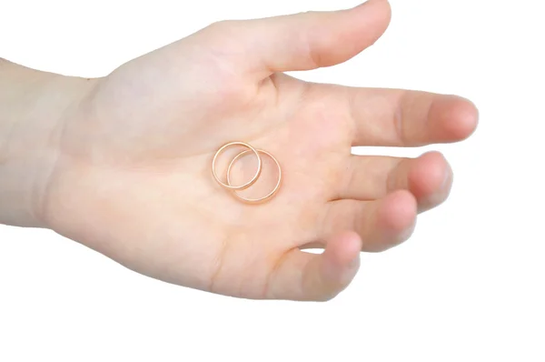 Man with two gold rings on palm — Stock Photo, Image