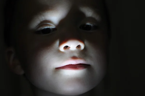 Little boy portrait in the dark making horror — Stock Photo, Image