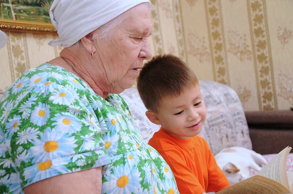 Grandmother and grandson reading book — Stock Photo, Image