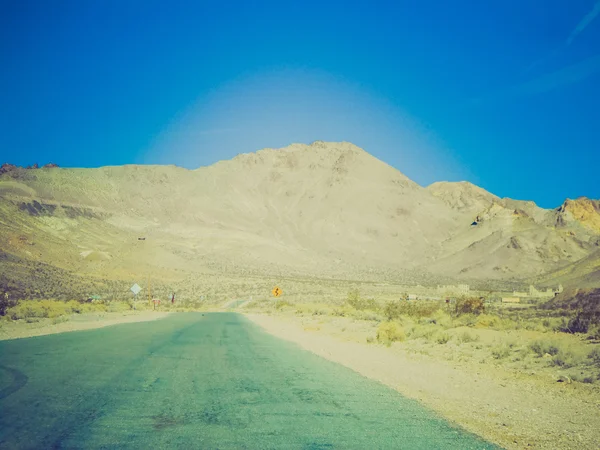 Retro look Rhyolite in Death Valley Nevada USA — Stock Photo, Image