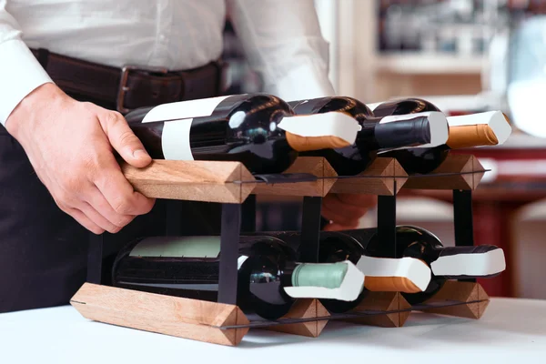 Professional sommelier holding wine holder — Stock Photo, Image