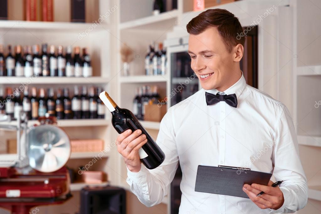 Professional sommelier being involved in work