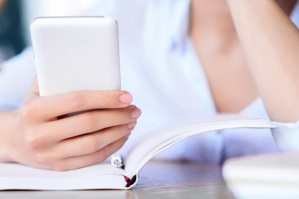 Modern woman holding mobile phone