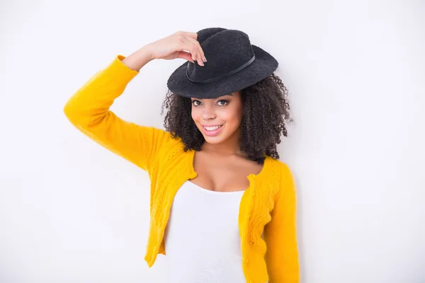 Nice mulatto woman  wearing black hat — Stock Photo, Image
