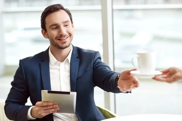 Pleasant businessman resting at the table — Stock Photo, Image