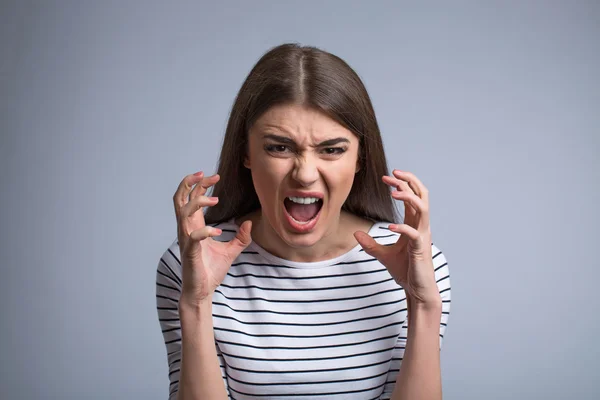 Pleasant girl expressing anger — Stock Photo, Image