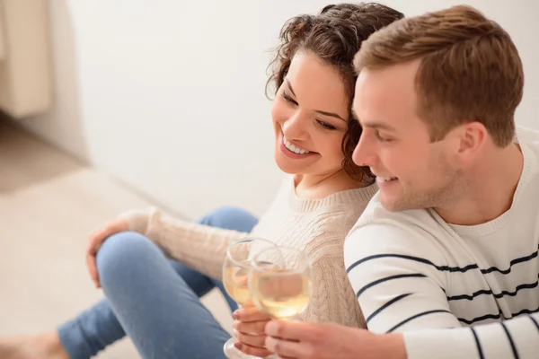 Positive couple resting on the floor — Stock Photo, Image