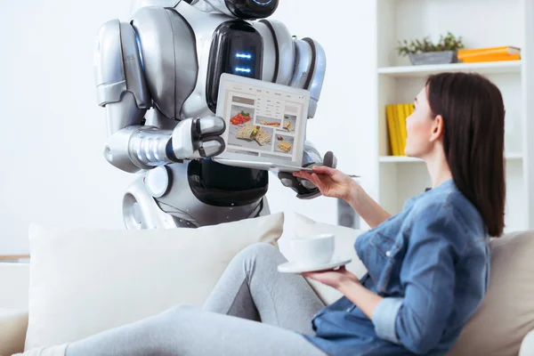 Modern robot holding laptop — Stock Photo, Image