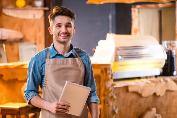 Pleasant waiter  working in the cafe — Stock Photo, Image