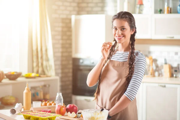 Cheerful delighted woman standing in the kitchen — Stock Photo, Image